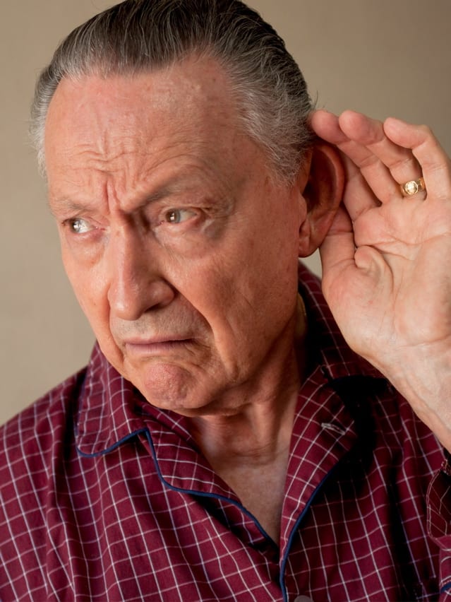 Senior man listening with hand over his ear | Credit: ARARF