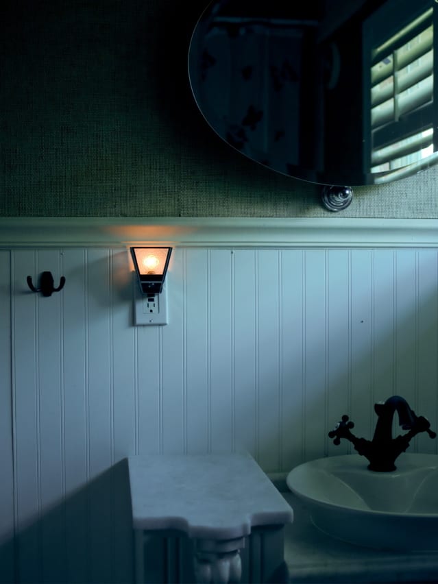 Night light on in dim bathroom | Credit: ARARF